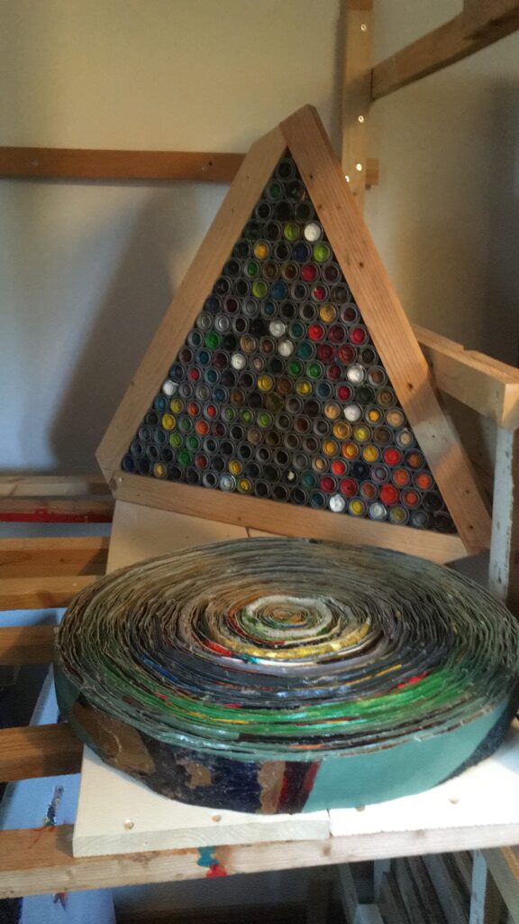 "Triangle from tube lid", Oil tube lids with clue, 55cm one site, the wood frame is just to protect, 2700.- and "Bildrolle No.1", Kunst Art - Dominik Lipp